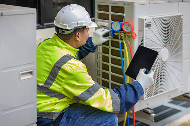 Professional Air Conditioning Repair technician working in West Des Moines, IA